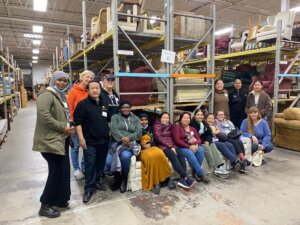 Photo of the Head Start team volunteering at the Bridging warehouse.