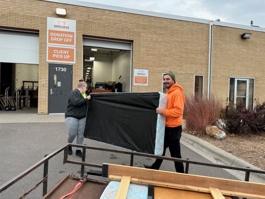 People moving a sofa.