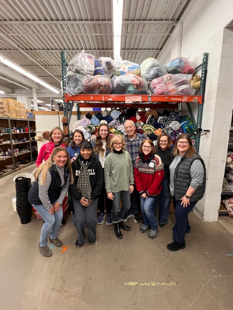 Navigate Forward Team Volunteers at Bridging, Helps Replenish Pillow Supply